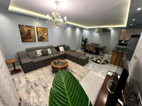 2BR Apt with Garden Pool beside AUC by Kemetland